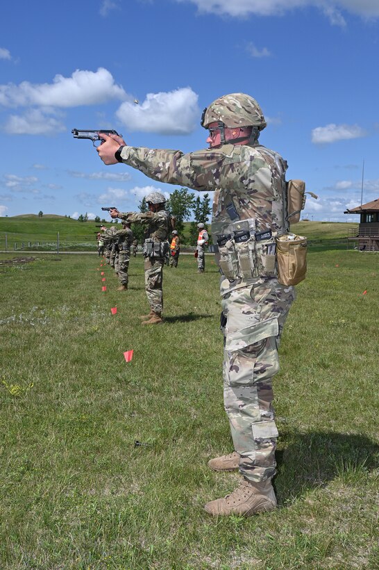 An Airman aims a pistol at a target during the 2020 North Dakota National Guard Adjutant General’s Combat Marksmanship Match at the Camp Grafton Training Center firing complex, near McHenry, North Dakota, July 11, 2020.