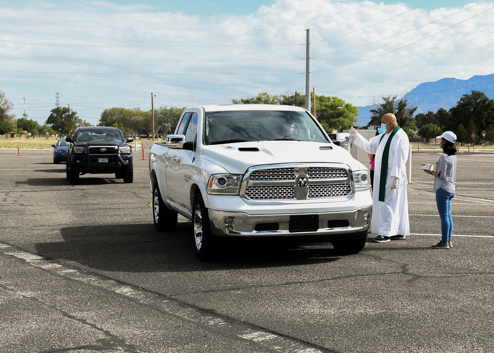 Priest giving communion