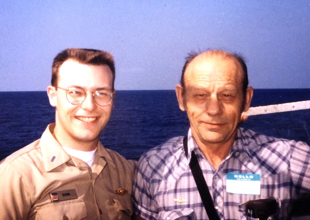 IMAGE: DAHLGREN, Va. - Paul Quinn, a Naval Surface Warfare Center Dahlgren Division (NSWCDD) engineer, is pictured with his father during a Tiger Cruise aboard USS Daniel Boone (SSBN-629), a James Madison-class ballistic missile submarine, while he was on active duty in 1992. Quinn won the Navy Meritorious Civilian Service Award, NSWCDD announced in July 2020. It recognizes Quinn for exceptional leadership and commitment to the Submarine Launched Ballistic Missile Program. NSWCDD Commanding Officer Capt. Casey Plew, Technical Director John Fiore, and U.S. Rep. Rob Wittman recognized Quinn with the award in the command's Honorary Awards video program to be released in July 2020. (U.S. Navy photo/Released).