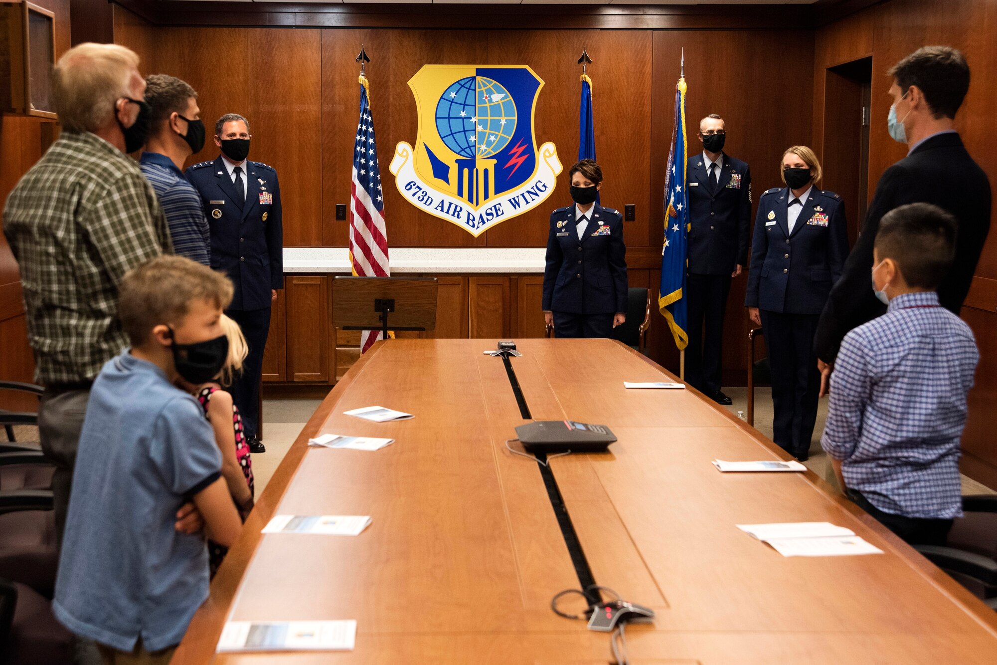 Family members of U.S. Air Force Col. Kirsten Aguilar and U.S. Air Force Col. Patricia Csànk attend the 673d Air Base Wing change of command ceremony at Joint Base Elmendorf-Richardson, Alaska, July 14, 2020. The 673d ABW is composed of a command section, the 673d Comptroller Squadron, and four groups; the 673d Mission Support Group, the 673d Medical Group, 673d Civil Engineer Group, and the 673d Logistics Readiness Group. These are the primary organizations responsible for providing installation management functions to ensure JBER remains America's premier strategic power projection platform. The wing supports and enables three AF total-force wings, one Army brigade and 55 tenant units. The change of command ceremony was adapted to comply with COVID-19 health and safety measures.