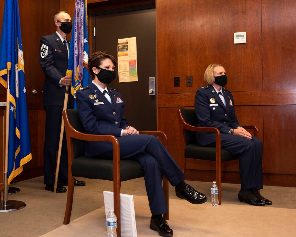 U.S. Air Force Col. Patricia Csànk and U.S. Air Force Col. Kirsten Aguilar listen to remarks during the 673d Air Base Wing change of command ceremony at Joint Base Elmendorf-Richardson, Alaska, July 14, 2020. The 673d ABW is composed of a command section, the 673d Comptroller Squadron, and four groups; the 673d Mission Support Group, the 673d Medical Group, 673d Civil Engineer Group, and the 673d Logistics Readiness Group. These are the primary organizations responsible for providing installation management functions to ensure JBER remains America's premier strategic power projection platform. The wing supports and enables three AF total-force wings, one Army brigade and 55 tenant units. The change of command ceremony was adapted to comply with COVID-19 health and safety measures.