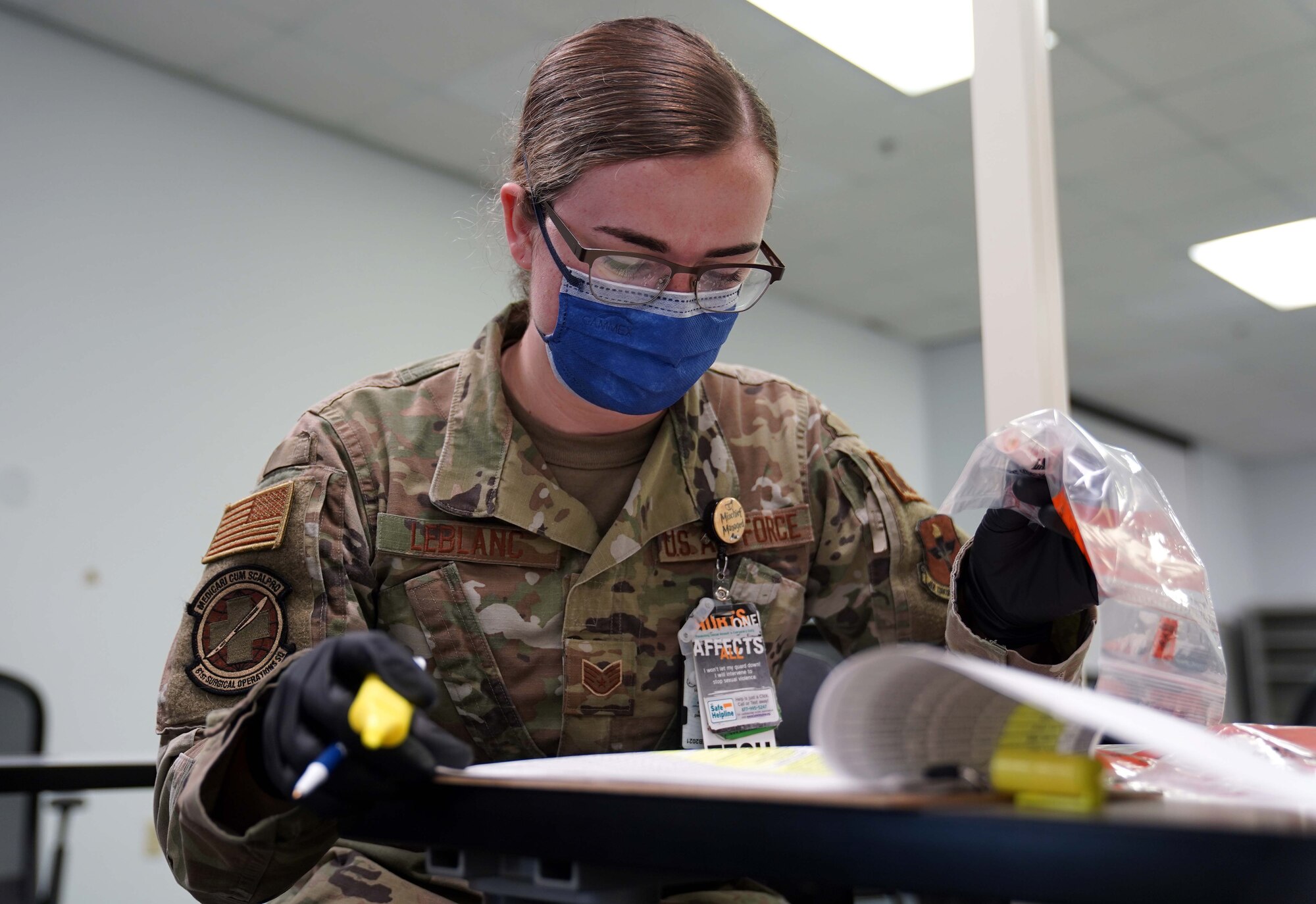 U.S. Air Force Staff Sgt. Taylor Leblanc, 81st Surgical Operations Squadron medical technician, records samples taken for COVID-19 testing at the Combat Readiness Training Center in Gulfport, Mississippi, July 14, 2020. Airmen from Keesler Air Force Base assisted in testing over 900 Sailors as a part of the joint and total force effort across Navy and Air Force active duty and guard installations along the Gulf Coast. (U.S. Air Force photo by Airman 1st Class Kimberly L. Mueller)