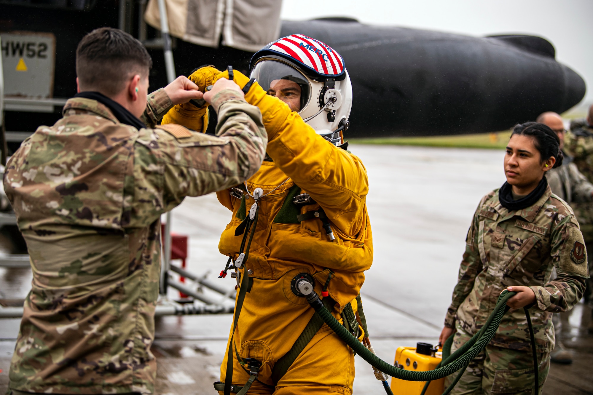 U.S. Air Force Capt. Joshua Hall, center, 99th Reconnaissance Squadron U-2 Dragon Lady pilot, fist bumps an Airman from the 99th Expeditionary Reconnaissance Squadron prior to takeoff at RAF Fairford, July 8, 2020. The U-2 aircraft assigned to the 9th Reconnaissance Wing, Beale Air Force Base, Calif., are currently deployed to RAF Fairford as part of the 99th ERS. The aircraft supplements a variety of missions that enhance regional and global security in support of U.S. and NATO allies and regional partners. The U.S. Air Force is engaged, postured and ready with credible force to assure, deter and defend in an increasingly complex security environment. (U.S. Air Force photo by Senior Airman Eugene Oliver)