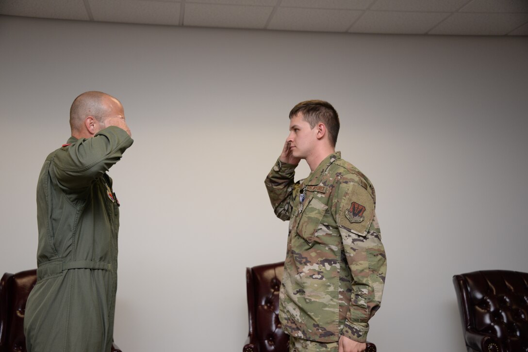 A photo of an Airman receiving a Purple Heart during a ceremony