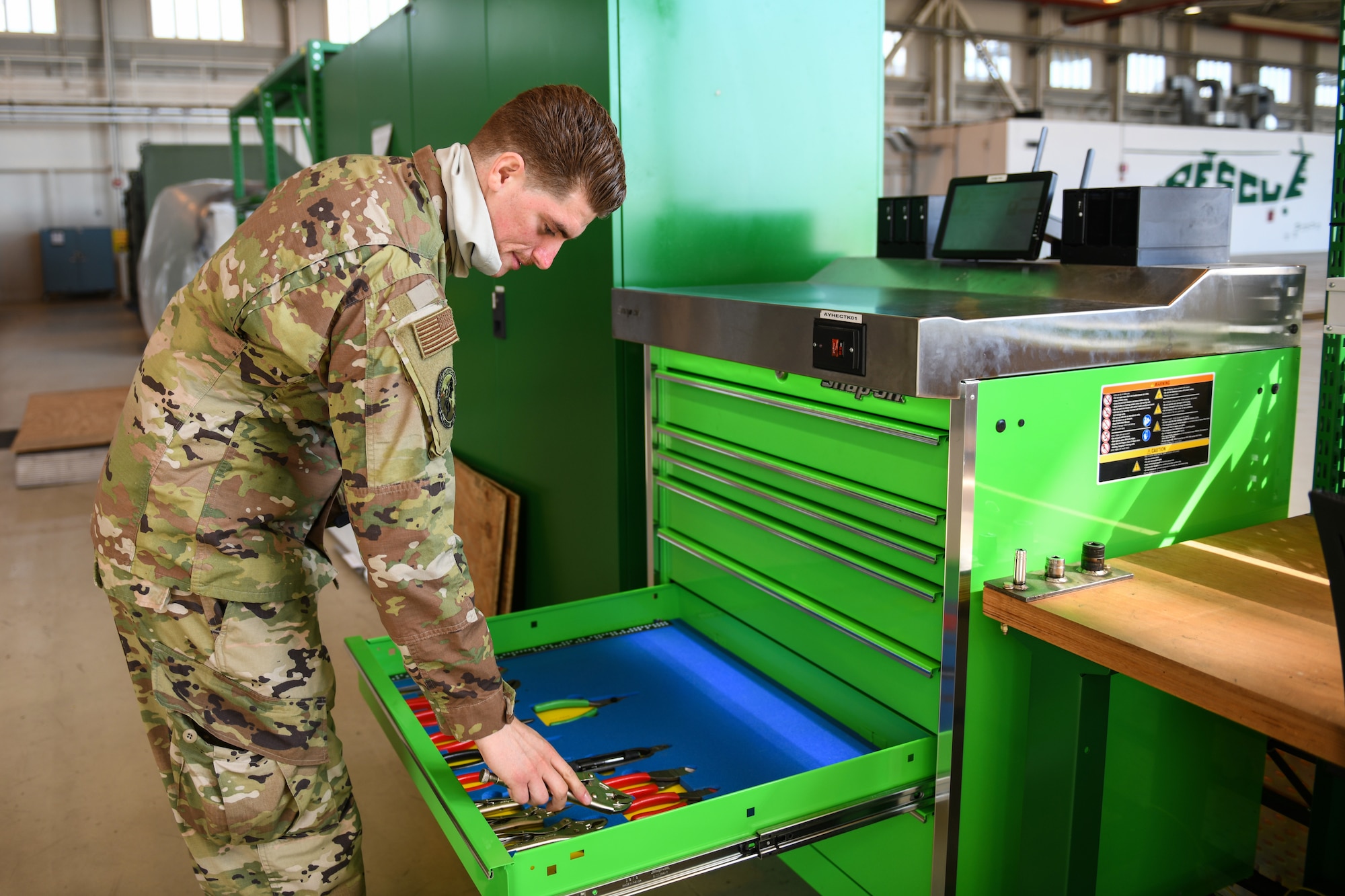 U.S. Air Force Staff Sgt. Edward T. Sims, 31st Aircraft Maintenance Squadron, 56th Helicopter Maintenance Unit support craftsman, opens an automated tool control system at Aviano Air Base, Italy, July 14, 2020. The 56th HMU renovated one of the hangars with new equipment. (U.S. Air Force photo by Airman 1st Class Ericka A. Woolever)