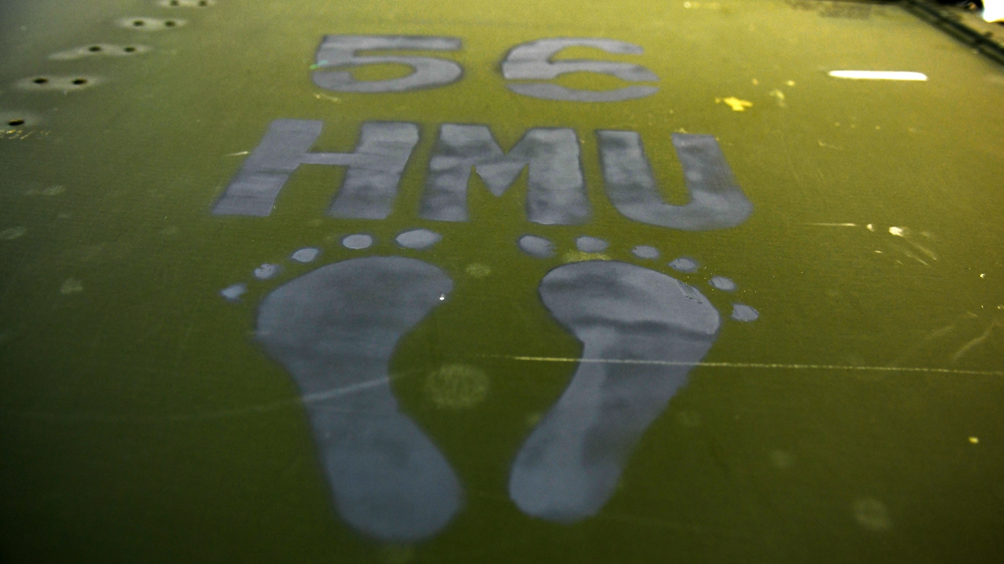 Jolly green foot prints represent the 56th Helicopter Maintenance Unit at Aviano Air Base, Italy, July 14, 2020. The 56th HMU renovated various section in hangar three. (U.S. Air Force photo by Airman 1st Class Ericka A. Woolever)