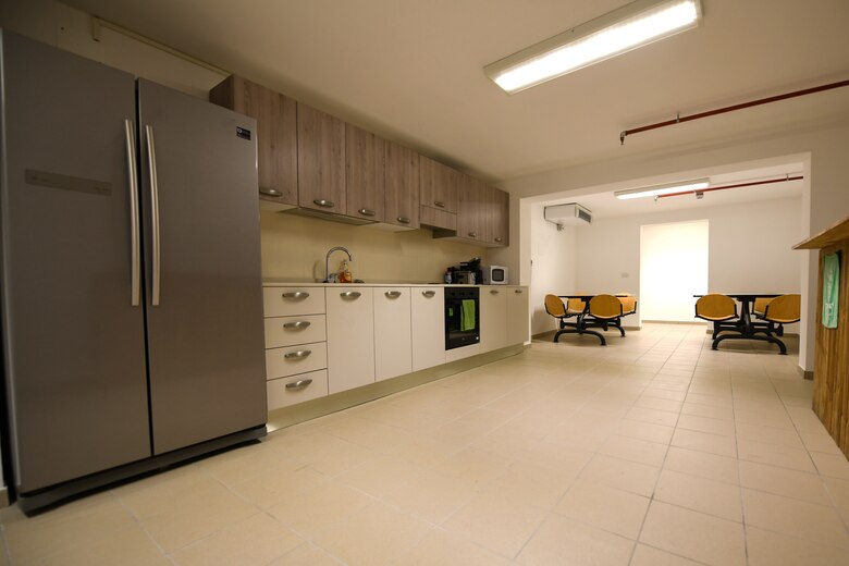 The 56th Helicopter Maintenance Unit built a new kitchen at Aviano Air Base, Italy, July 14, 2020. The 56th HMU opened a new support section, crew chief and specialist office, productions office, kitchen, full bathroom, and a locker room with showers. (U.S. Air Force photo by Airman 1st Class Ericka A. Woolever)