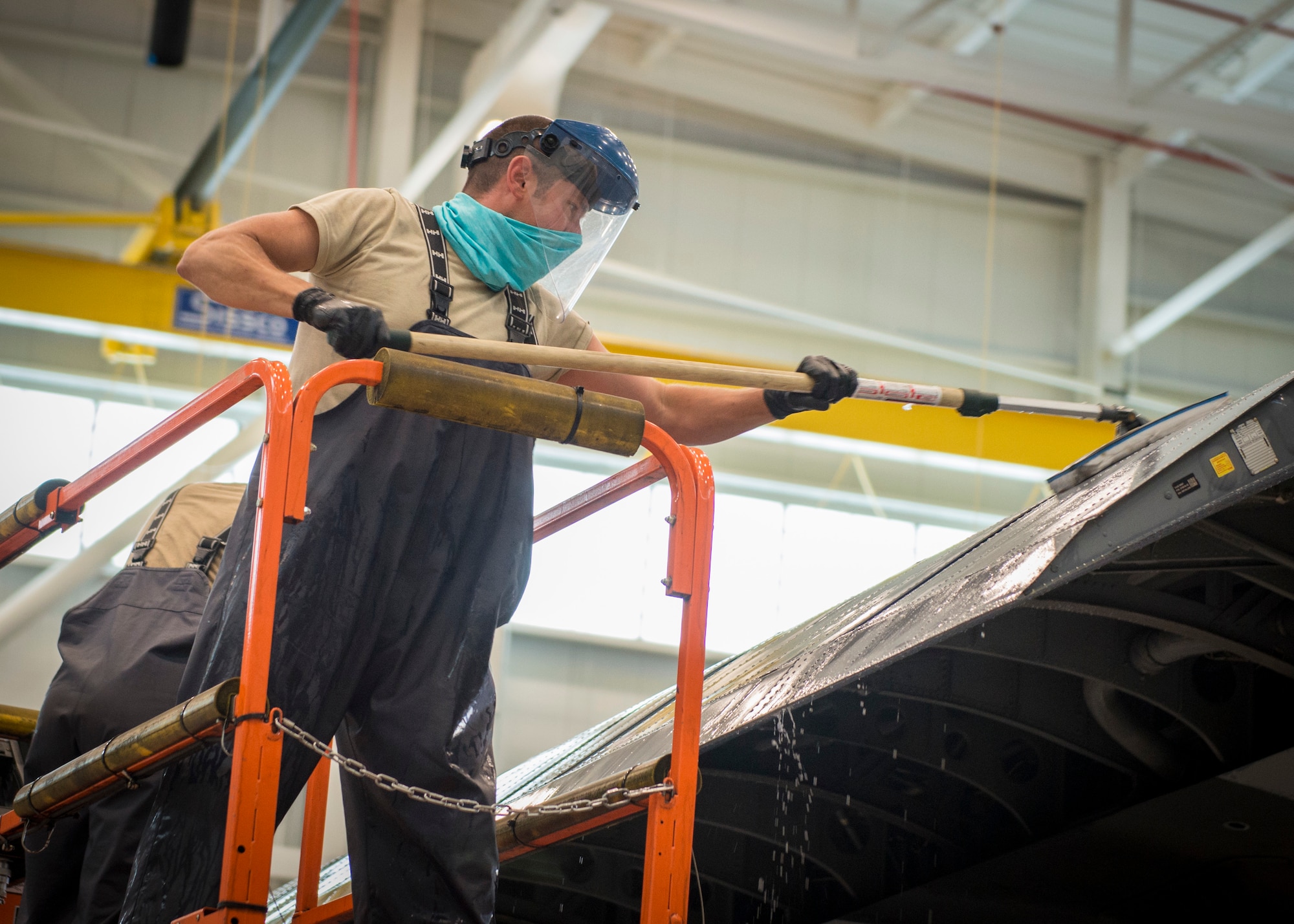 Airman 1st Class A.J. Raffles, 103rd Maintenance Squadron structural maintenance specialist, scrubs the wing of a C-130H Hercules during an aircraft wash at the Bradley Air National Guard Base fuel cell and corrosion control facility in East Granby, Connecticut, July 13, 2020. Each of the 103rd Airlift Wing’s eight C-130 aircraft are washed every six months to clean contaminants and prevent corrosion, ensuring aircraft readiness and extending its life cycle. (U.S. Air National Guard photo by Staff Sgt. Steven Tucker)