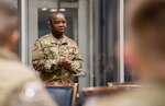 Capt. Robert Gaygay, 138th Medical Group, speaks with Airmen at the Tulsa Air National Guard Base, Oklahoma, April 23, 2020. In response to the COVID-19 outbreak, 25 Airmen from the 138th Fighter Wing are working with the Tulsa Food Bank.