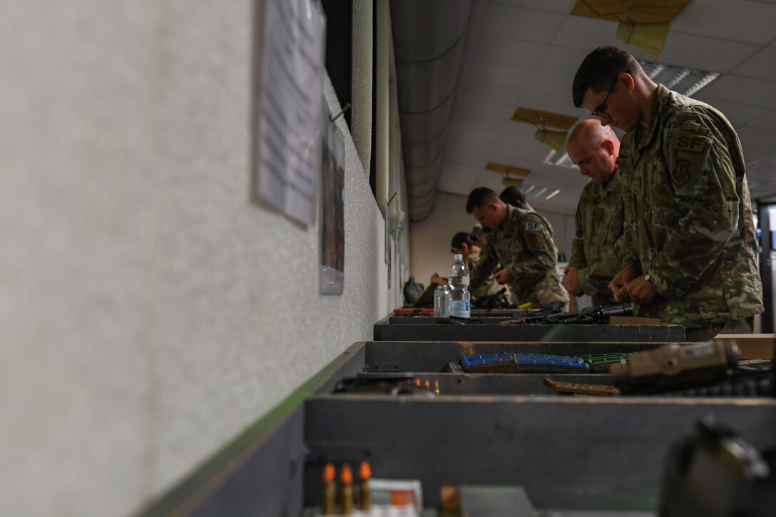Airmen with the 31st Fighter Wing load magazines during a Combat Arms Training and Maintenance class at Aviano Air Base, Italy, July 14, 2020. Aviano received M18 handguns last April and began training at Aviano on June 1, 2020. The modular design of the M18 handgun provides improved ergonomics, target acquisition, reliability and durability in comparison to the M9 Beretta, which was used by the Air Force for over 30 years.  (U.S. Air Force photo by Airman 1st Class Thomas S. Keisler IV)