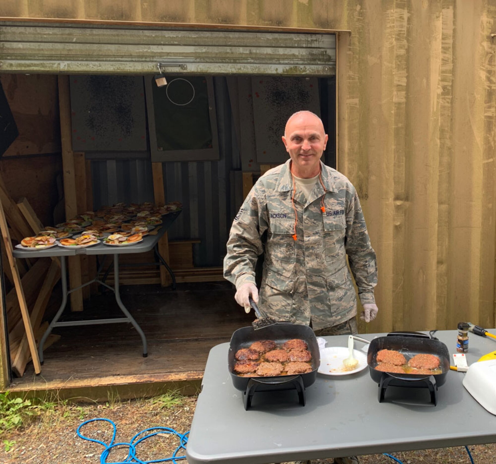 Airman prepares burgers