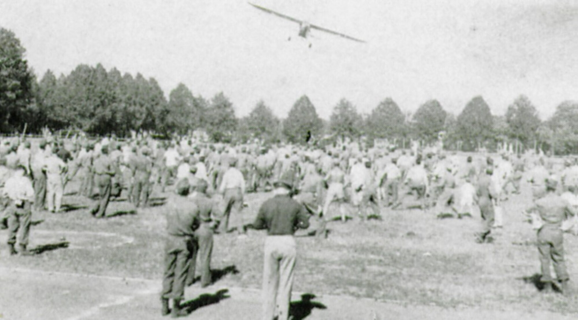 A Piper L-4 liaison aircraft cruised over the second birthday crowd at the sport-platz – if you caught a baseball dropped from the plane it was worth $10.00! (The Story of the 371st Fighter Group in the E.T.O.)