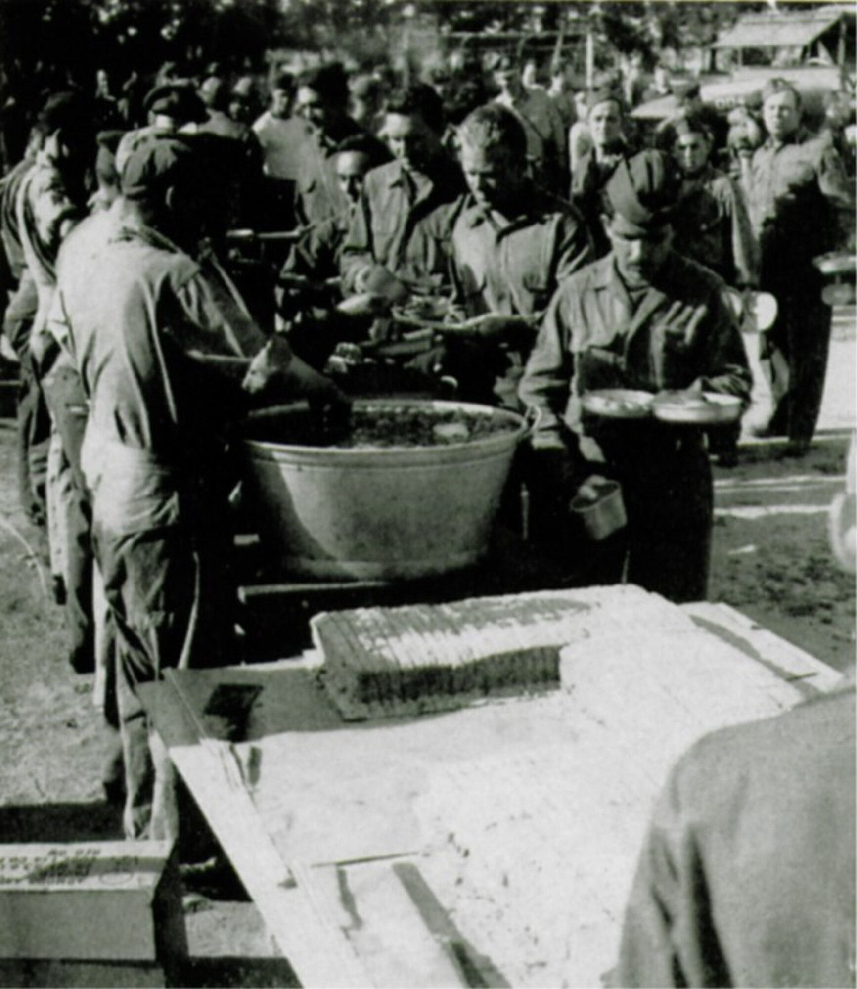 Barbecued chicken, potato salad, tomatoes and a birthday cake served as the fare on the group’s second anniversary (The Story of the 371st Fighter Group in the E.T.O.)