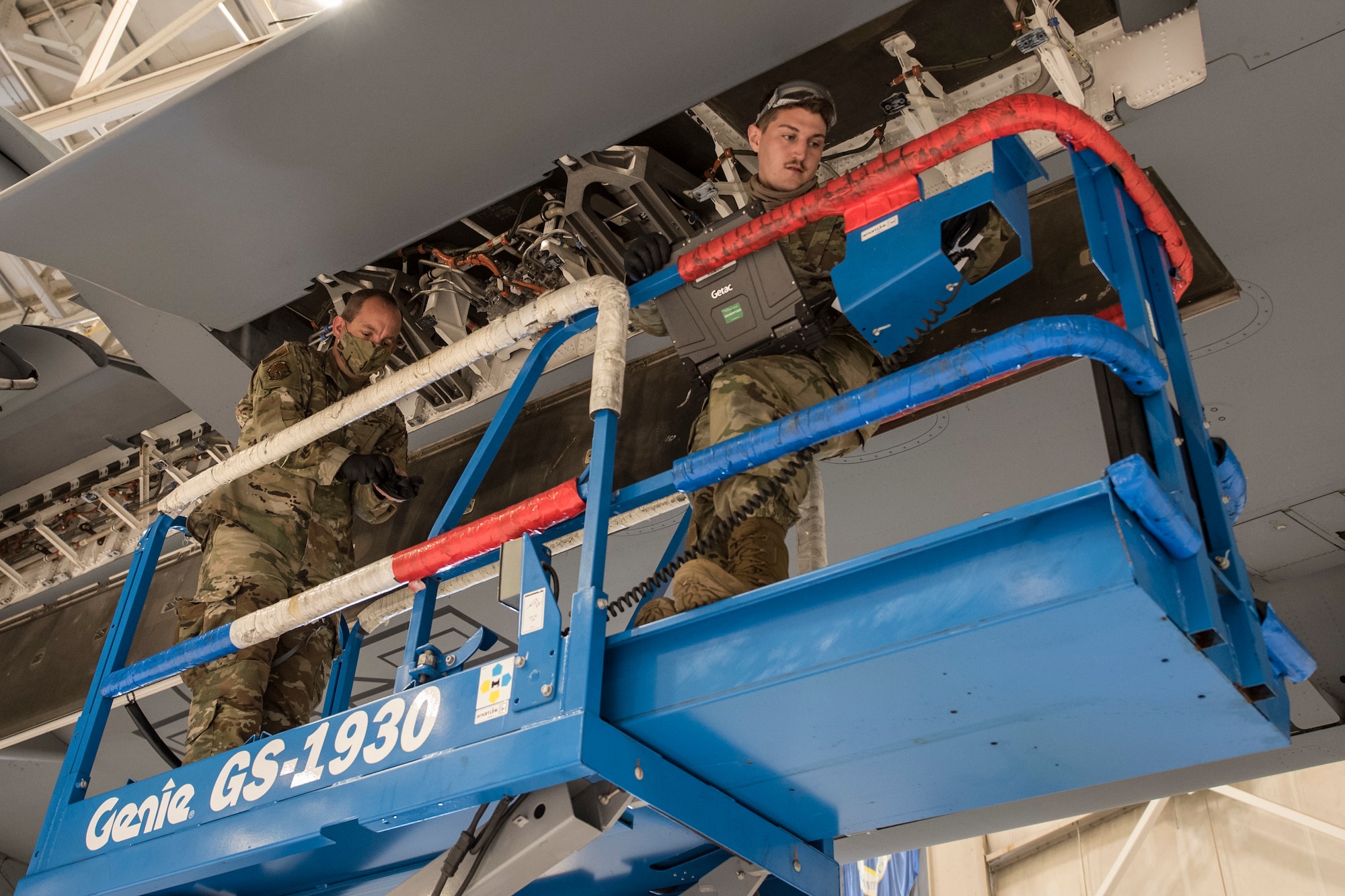 Photo of Airmen conducting an inspection on a C-17 Globemaster III.