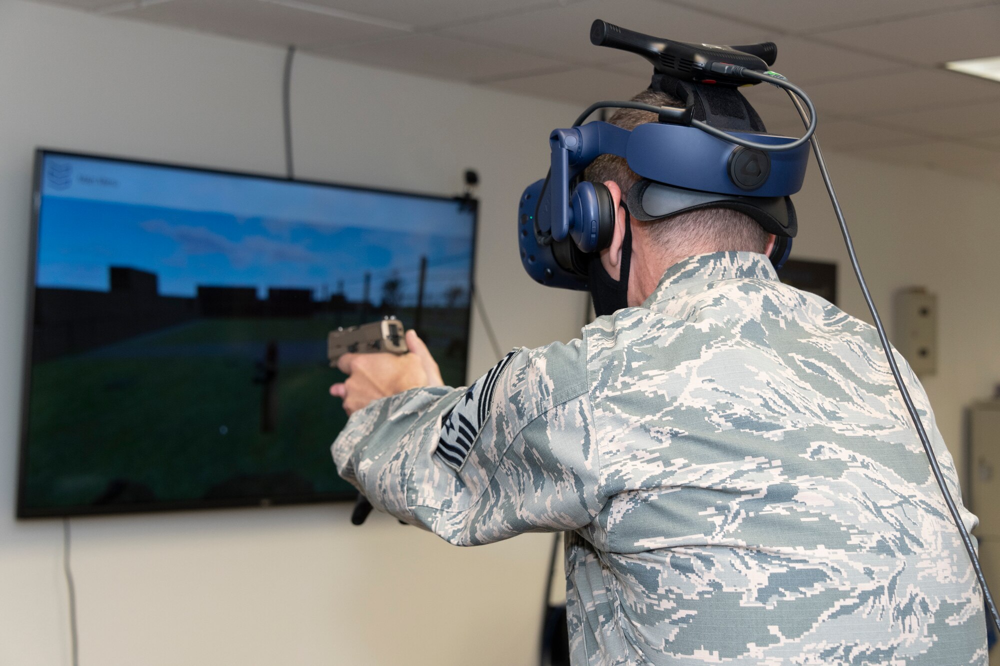 U.S. Air Force Chief Master Sgt. Derek Crowder, 60th Air Mobility Wing command chief, participates in a virtual reality technology demonstration during Leadership Rounds July 10, 2020, at Travis Air Force Base, California. The 60th SFS uses this system to train and evaluate Airmen on use-of-force law enforcement technique. The Leadership Rounds program provides 60th AMW leadership an opportunity to interact with Airmen and get a detailed view of each mission performed at Travis AFB. (U.S. Air Force photo by Heide Couch)