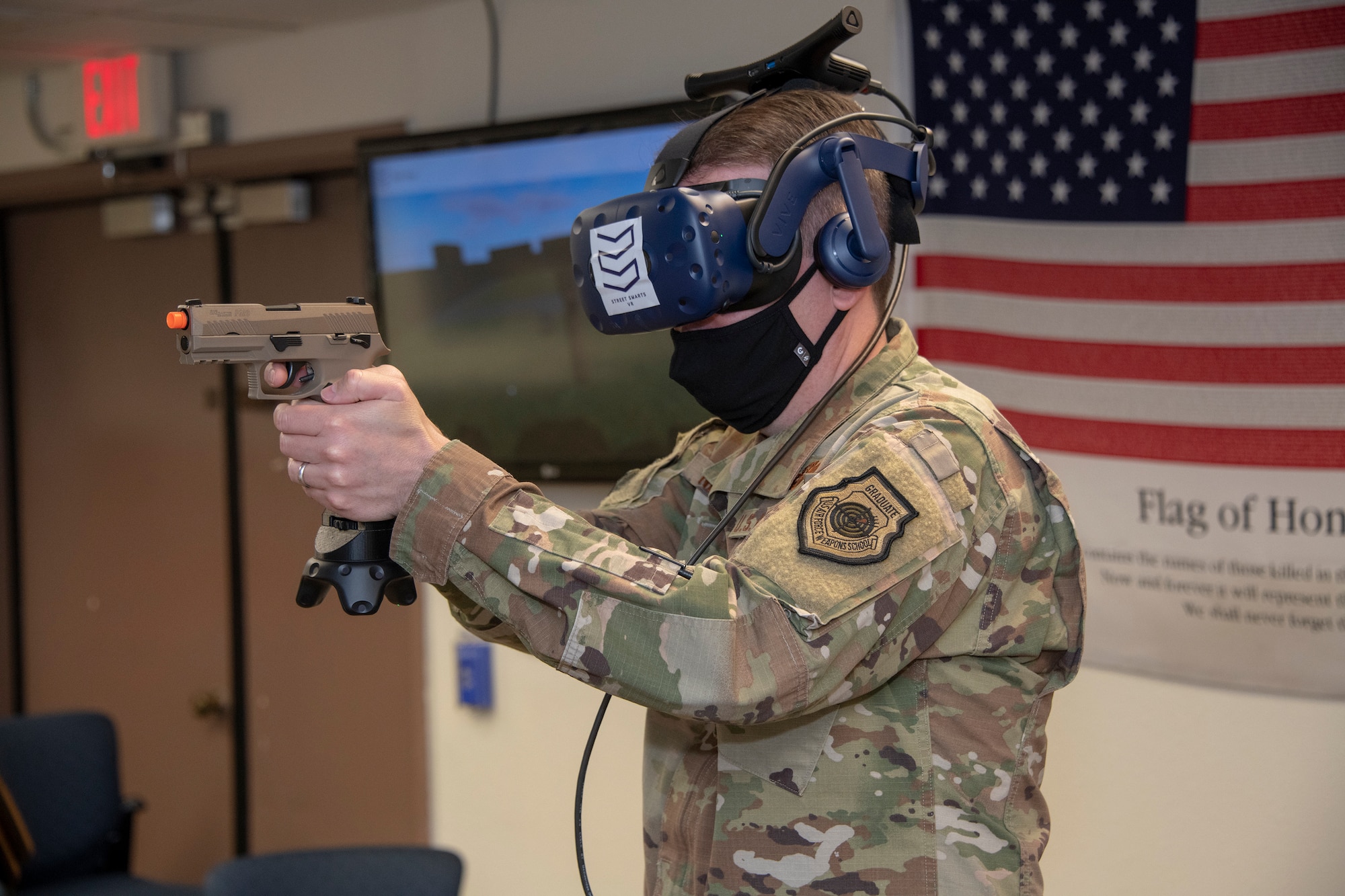 U.S. Col. Jeffrey Nelson, 60th Air Mobility Wing commander, participates in a virtual reality technology demonstration during Leadership Rounds July 10, 2020, at Travis Air Force Base, California. The 60th SFS uses this system to train and evaluate Airmen on use-of-force law enforcement technique. The Leadership Rounds program provides 60th AMW leadership an opportunity to interact with Airmen and get a detailed view of each mission performed at Travis AFB. (U.S. Air Force photo by Heide Couch)