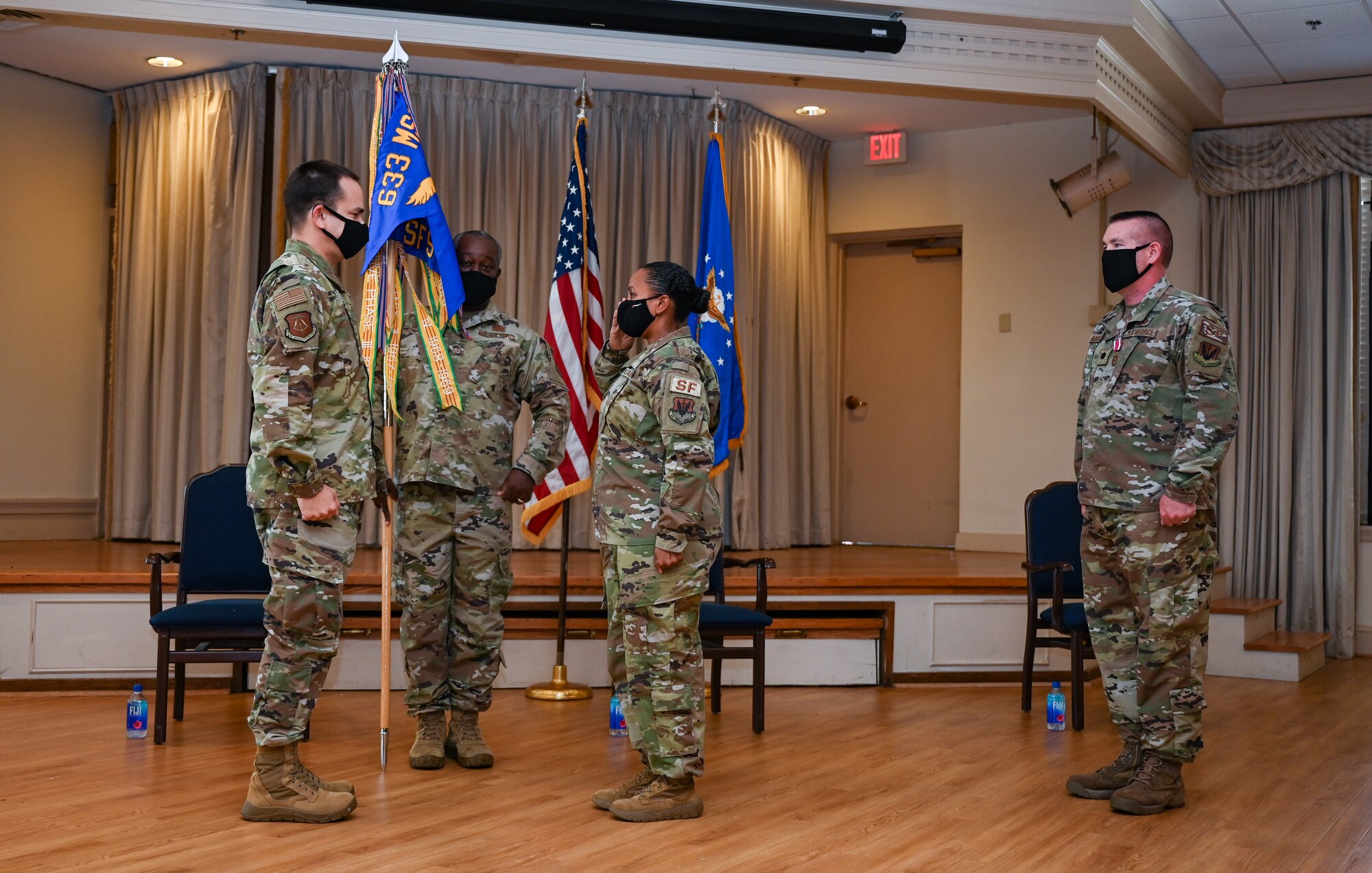 U.S. Air Force Major Lidia Iyassu, 633rd Security Forces Squadron commander, renders a salute to Col. Allen Heritage, 633rd Mission Support Group commander as she assumed command of the 633rd SFS at Joint Base Langley-Eustis, Virginia, July 15, 2020. The change of command ceremony was streamed virtually because of Coronavirus precautions. (U.S. Air Force photo by Airman 1st Class Sarah Dowe)