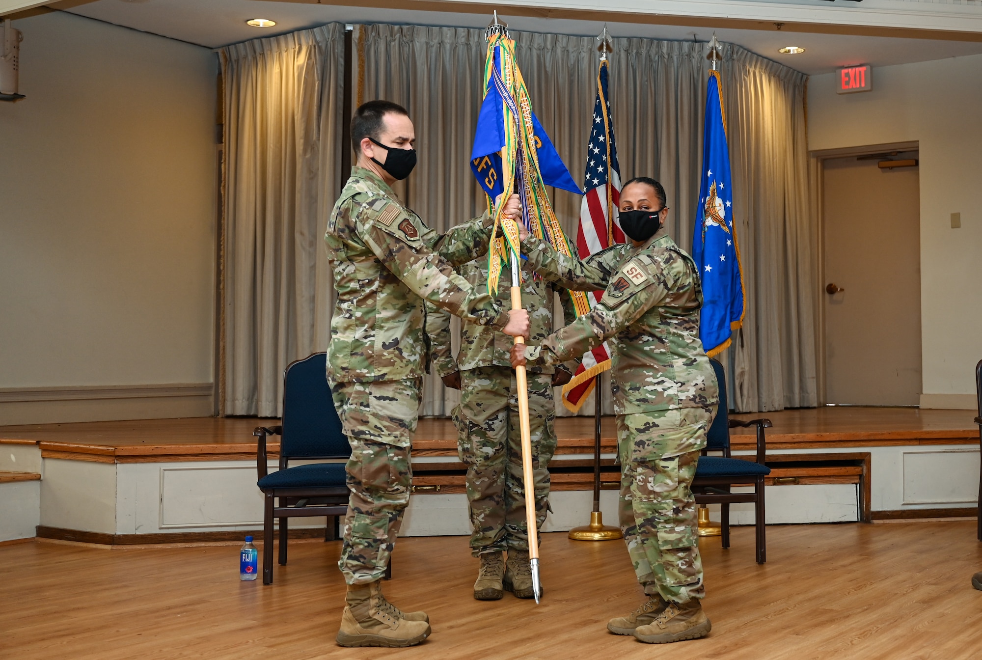 U.S. Air Force Major Lidia Iyassu, 633rd Security Forces Squadron commander, grips the guidon as she assumes command of the 633rd SFS at Joint Base Langley-Eustis, Virginia, July 15, 2020. Iyassu previously commanded the SFS squadron at Barksdale Air Force Base, Louisiana. (U.S. Air Force photo by Airman 1st Class Sarah Dowe)