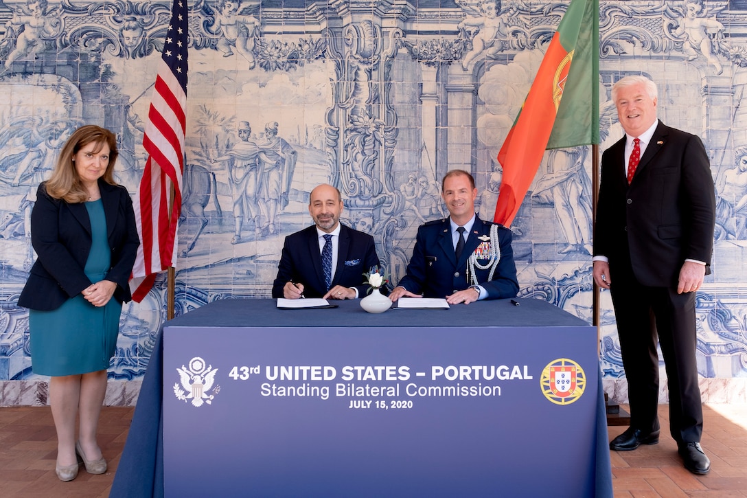 Dr. Alberto António Rodrigues Coelho (seated left), Director-General for Portuguese National Defense Resources, signs the Space Situational Awareness Data Sharing Agreement on July 15 in Lisbon, Portugal. He is joined by Ambassador Madalena Fischer (standing left), Ministry of Foreign Affairs’ Director General for Foreign Policy; George Glass (standing right), U.S. Ambassador to Portugal; and U.S. Air Force Col. Andrew Bernard (seated right), Senior Defense Official and Defense Attaché.