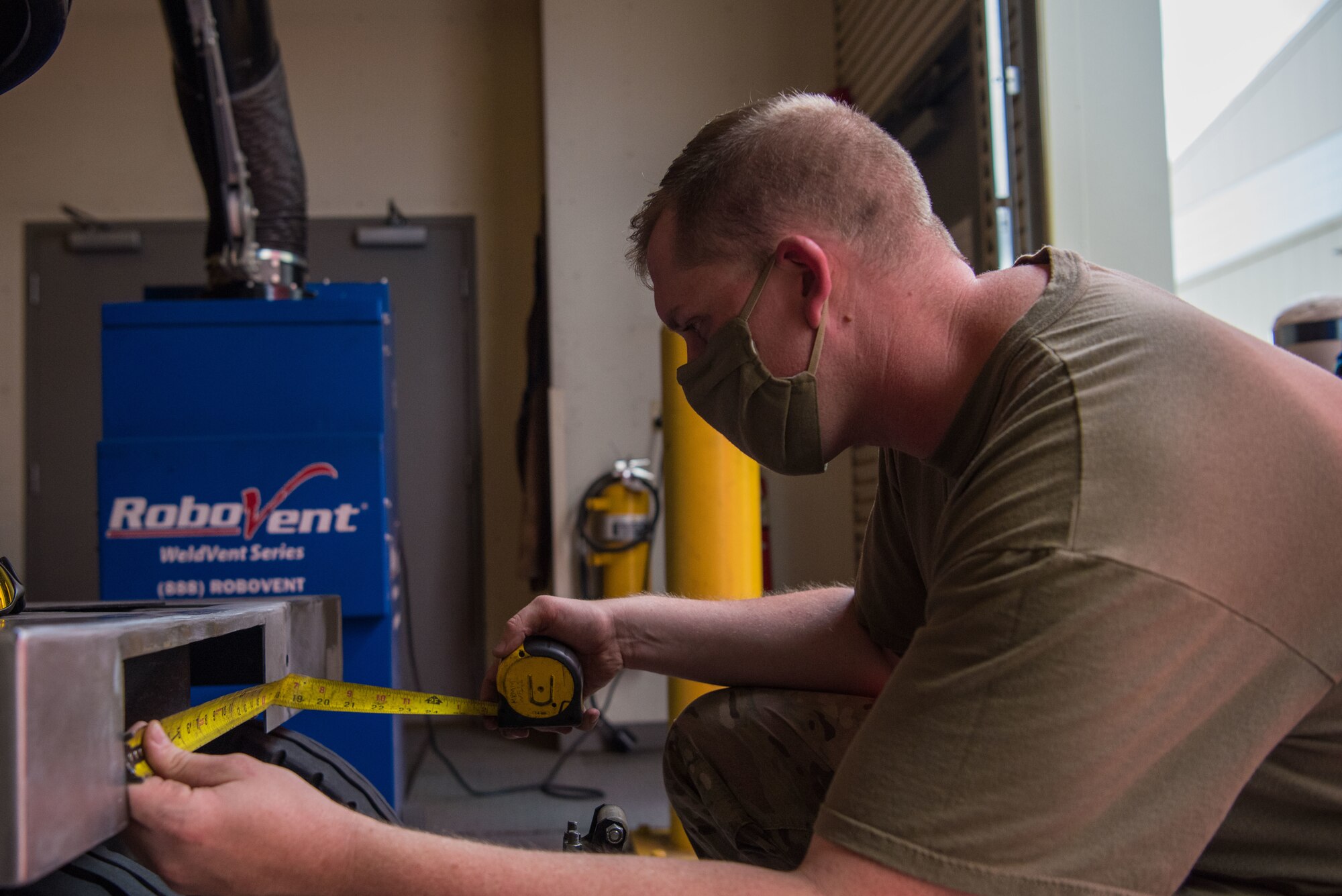 Senior Airman Jay Powell, 22nd Maintenance Squadron metals technology journeyman, verifies the measurement of a damaged area to repair a mobile aircraft generator July 9, 2020, at McConnell Air Force Base, Kansas. Metals technology Airmen machine and fabricate parts and repair items in order to fulfill their mission of maintaining equipment. (U.S. Air Force photo by Airman 1st Class Marc A. Garcia)