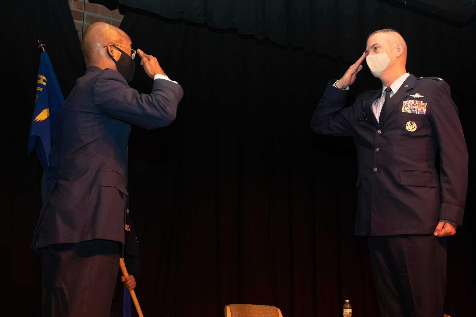 Airman salutes other Airman