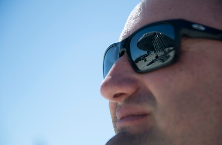 photos of an airman checking a KC-10 Globemaster aircraft