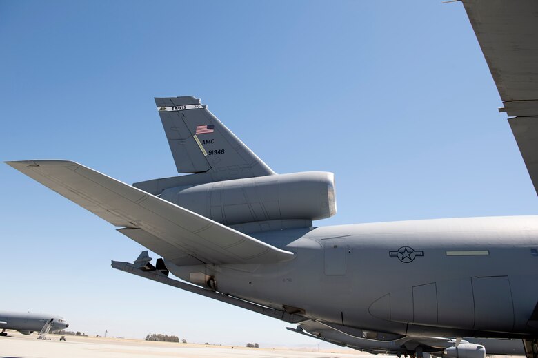 photos of an airman checking a KC-10 Globemaster aircraft