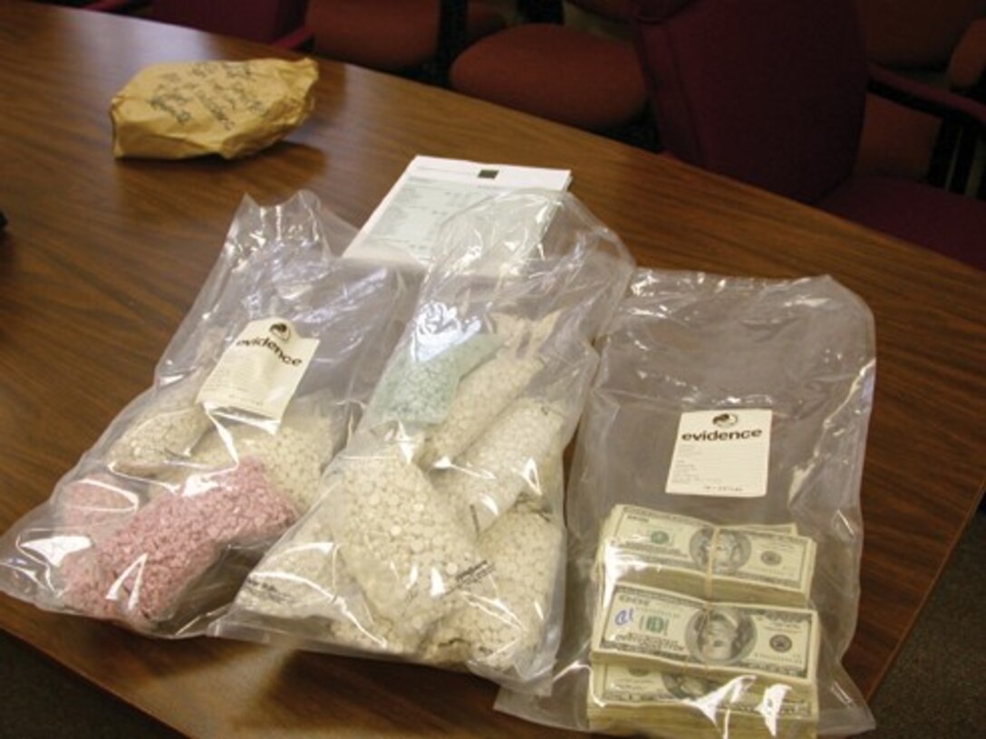Detailed searches of the subject’s residence, the bank safety deposit box, and the subject’s financial resources yielded the seizure of 16,000 Ecstasy pills, $50,000 in cash, an ounce of methamphetamine, an assault rifle, three vehicles, one motorcycle and the identification of additional money in various investment accounts for asset forfeiture. (Courtesy Photo)