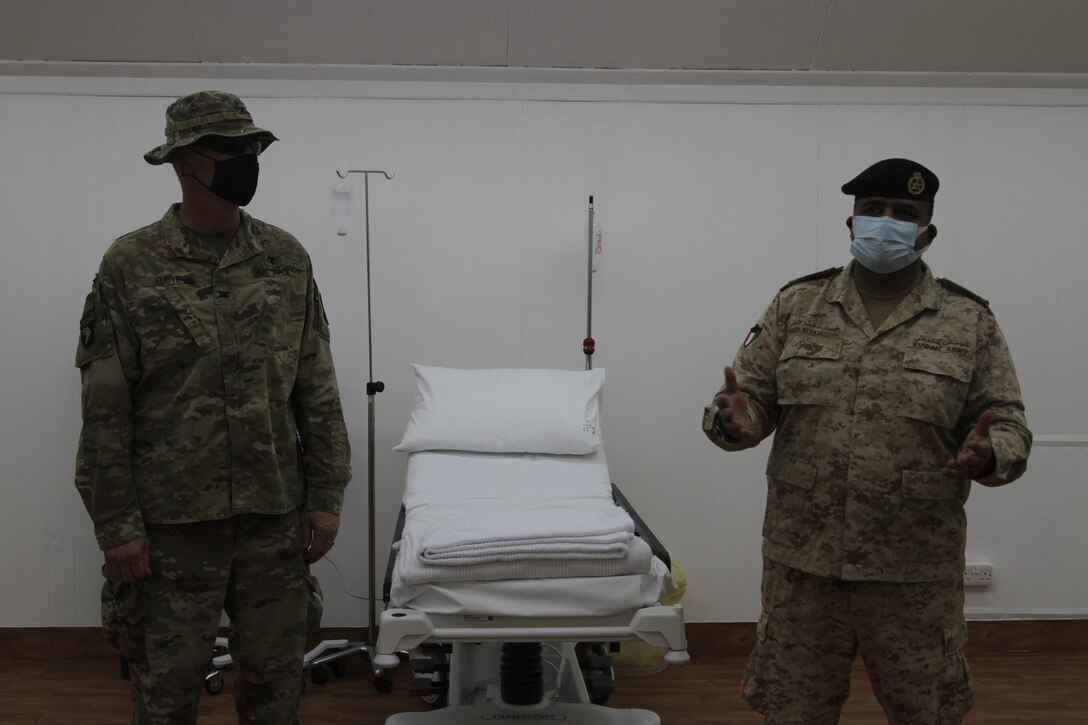 Kuwaiti Col. Raed Altajalli stands with U.S. Army Col. William Floyd of the 338th Medical Brigade, at a quarantine facility in Kuwait, July 3rd, 2020. U.S. and Kuwaiti forces have been working together to stop the spread of COVID-19 in Kuwait. (U.S. Army photo by Sgt. Andrew Valenza)