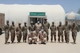 Kuwaiti Soldiers stand with U.S. Army Soldiers of the 3rd Medical Command at a quarantine facility in Kuwait, July 3rd, 2020. U.S. and Kuwaiti forces have been working together to stop the spread of COVID-19 in Kuwait. (U.S. Army photo by Sgt. Andrew Valenza)