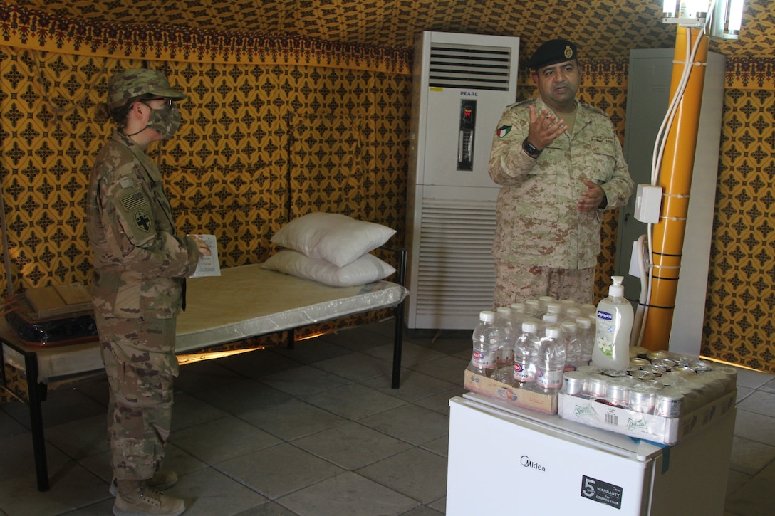 Kuwaiti Col. Raed Altajalli shows U.S. Army Soldiers of the 3rd Medical Command tents for a quarantine facility in Kuwait, July 3rd, 2020. U.S. and Kuwaiti forces have been working together to stop the spread of COVID-19 in Kuwait. (U.S. Army photo by Sgt. Andrew Valenza)