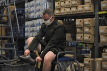 male Soldier trying on a new pair of dress shoes.