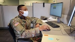 Pfc. Calen Massey, 3rd Battalion, 161st Infantry Regiment, verifies unemployment data in the Employment Security Department database in Lacey, Wash., June 24, 2020. The Washington National Guard has been helping the state ESD process a backlog of unemployment claims during the COVID-19 pandemic.