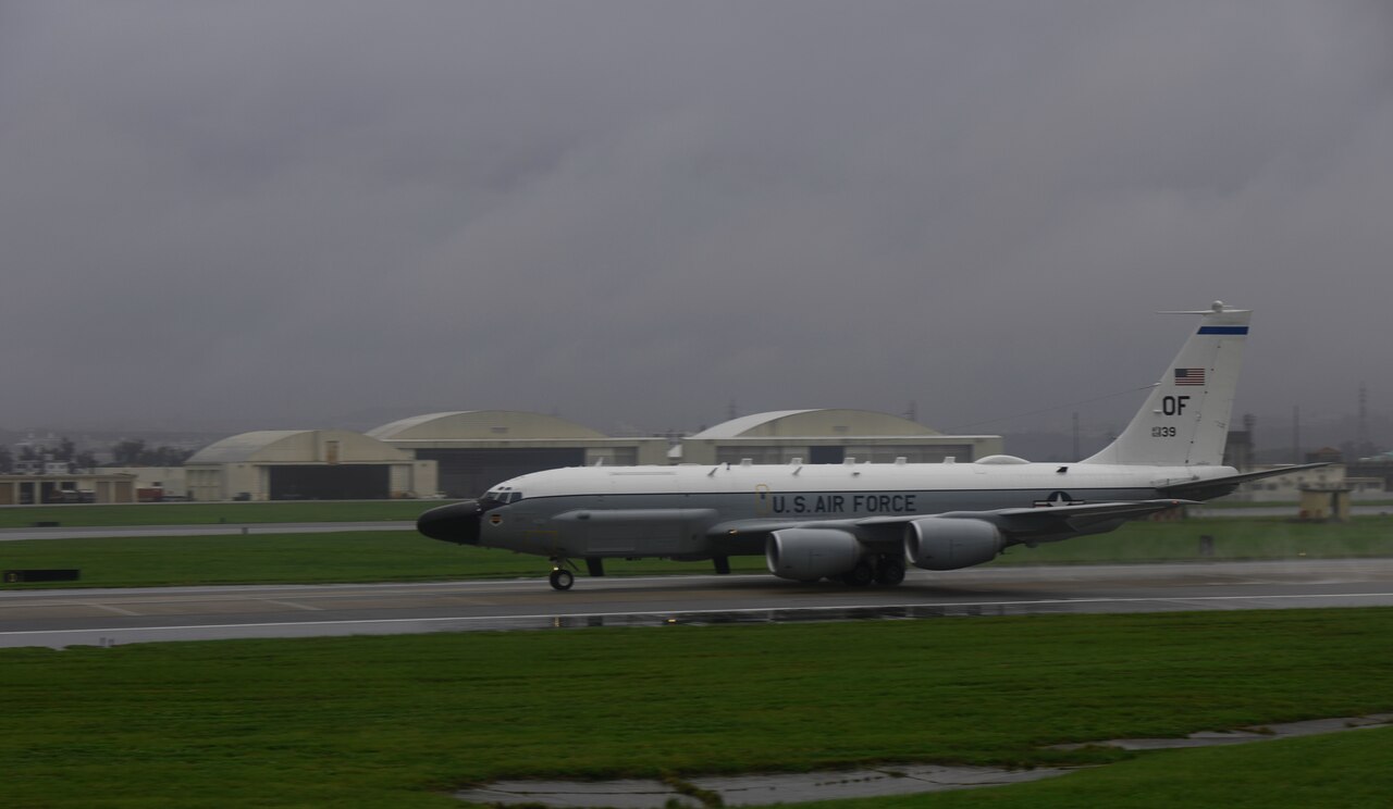 A large aircraft on the runway preparing for takeoff.