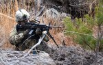 New York Army National Guard Spc. Guadalupe Lopez, B Company, 1st Battalion 69th Infantry, M249 SAW gunner, practices taking out enemy targets during training at the 106th Rescue Wing, F.S. Gabreski Air National Guard Base in Westhampton Beach, N.Y., Jan. 11, 2020. Soldiers of the 69th Infantry conducted ground combat-focused field exercises at the 106th RQW as part of their monthly training.