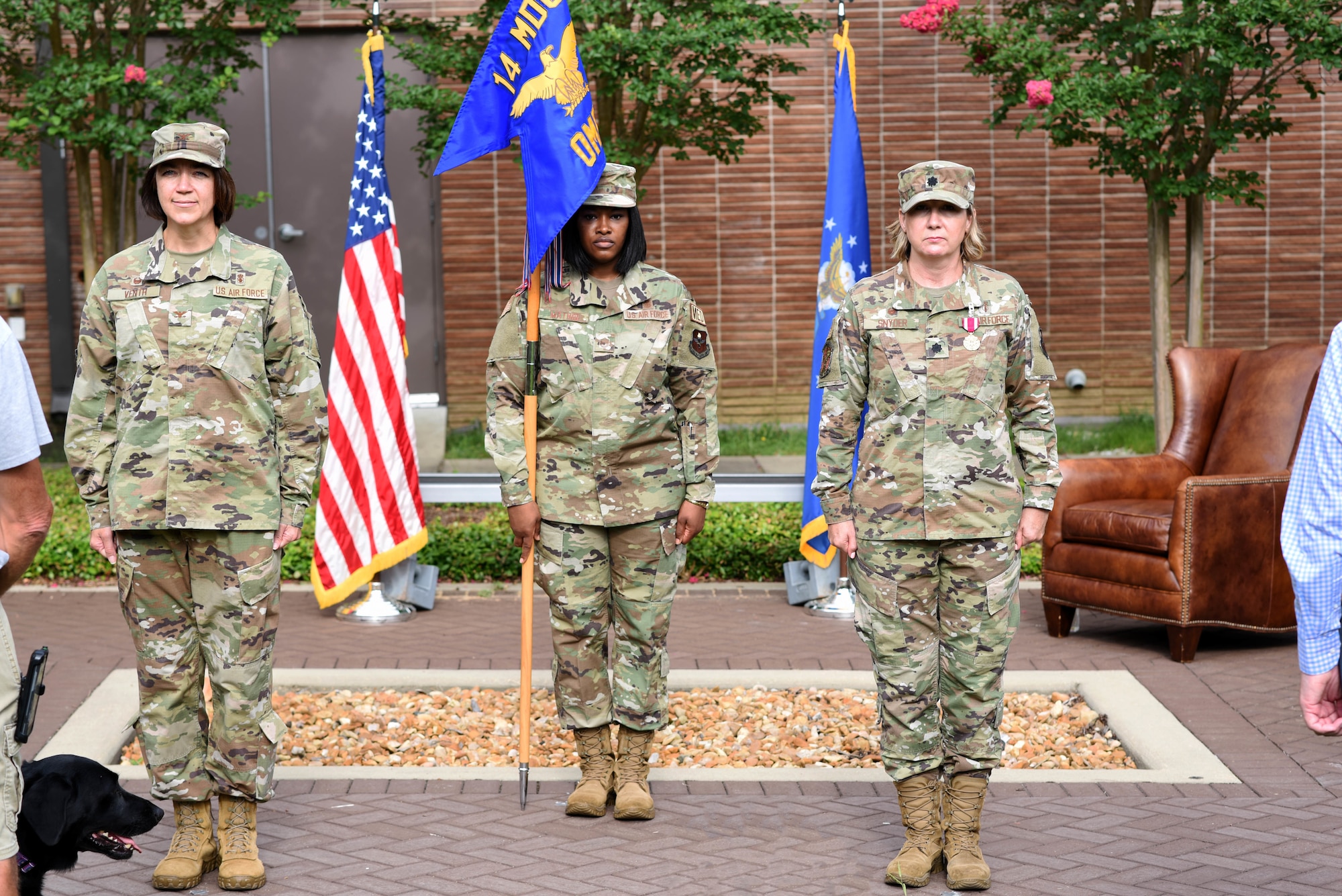 Col. Betty Venth (left), 14th Medical Group commander, and Lt. Col. Tracy Snyder (right), former 14th OMRS commander, stand at attention July 16, 2020, at a change of command on Columbus Air Force Base, Miss. The 14th OMRS has the responsibility for preventive, integrated health care through mental health, public health, physical therapy, optometry and health and wellness activities for Columbus AFB. (U.S. Air Force photo by Senior Airman Jake Jacobsen)