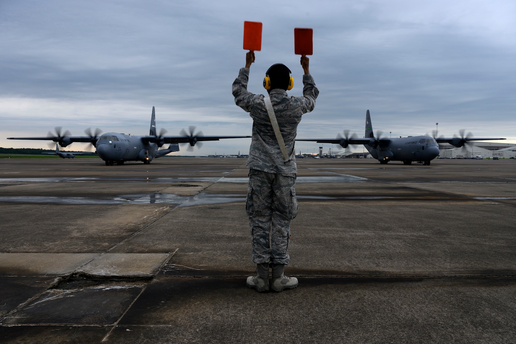Airman 1st Class Jayce Gibson, 19th Aircraft Maintenance squadron crew chief, watches a C-130J Super Hercules taxi during the Herk Nation Stampede at Little Rock Air Force Base, Arkansas, July 14, 2020.