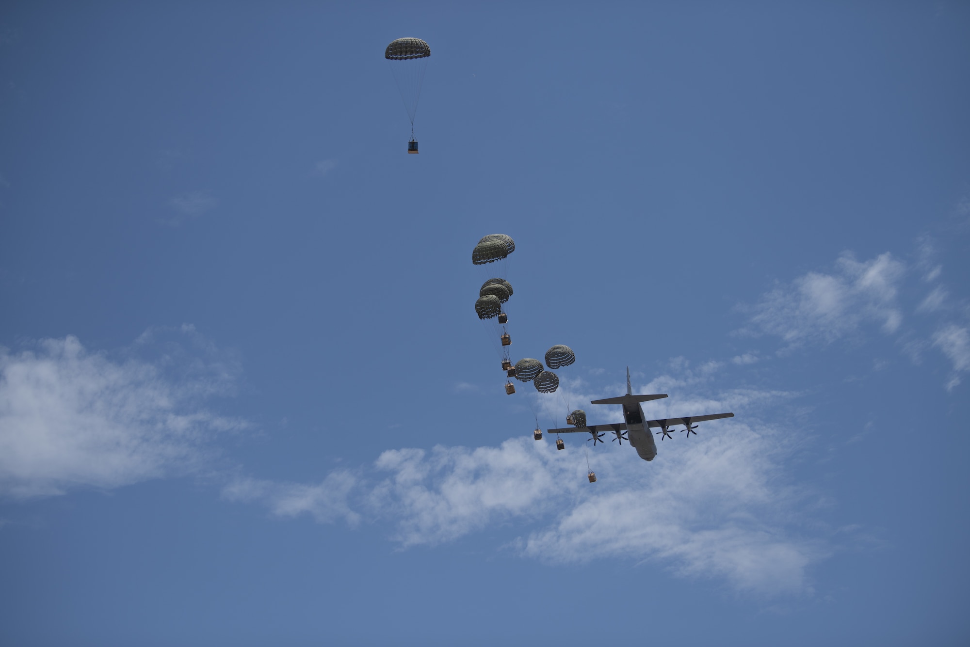 Containerized Delivery System Bundles are dropped from a C-130J Super Hercules aircraft during a Joint Forcible Entry exercise at Dyess Air Force Base, Texas, July 14, 2020.