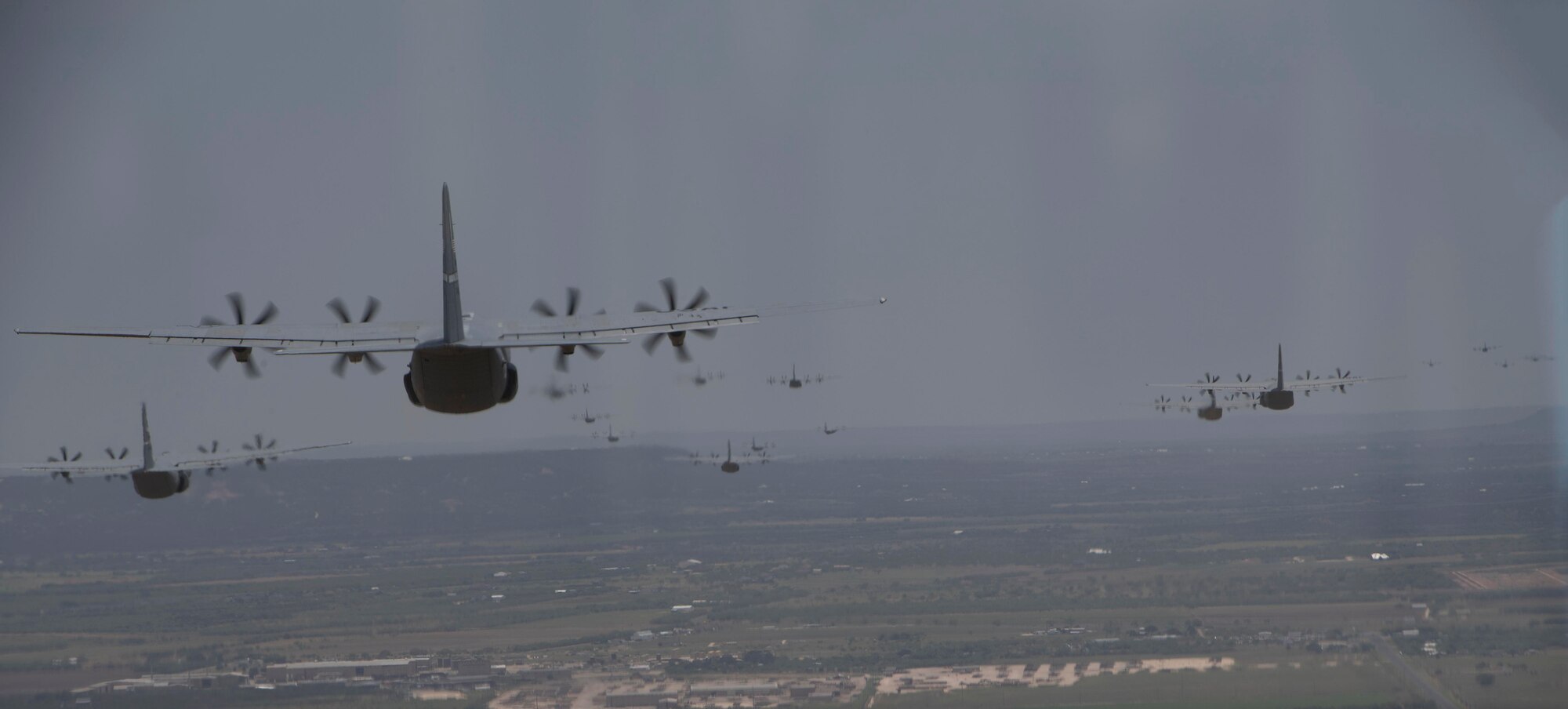Multiple C-130J Super Hercules aircraft from the 19th Airlift Wing and 317th AW fly in formation during the Herk Nation Stampede, July 14, 2020.