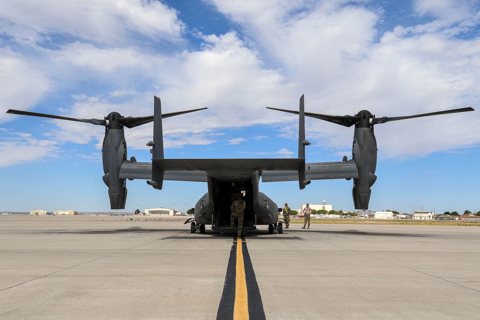 Maintainers do pre-flight checks on CV-22 Osprey.