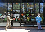 Army 2nd Lt. Justin Lee, a platoon leader assigned to the 104th Medical Company Area Support, Maryland National Guard, poses April 9, 2020, with Celia Goughenour, the director of nursing for Crofton Care and Rehabilitation Center in Crofton, Maryland.