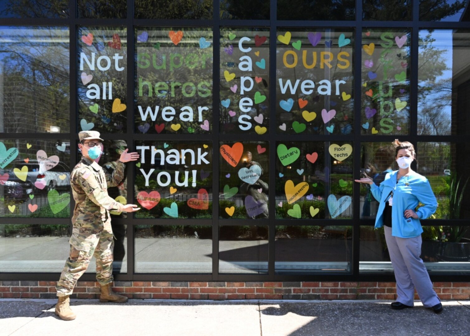 Army 2nd Lt. Justin Lee, a platoon leader assigned to the 104th Medical Company Area Support, Maryland National Guard, poses April 9, 2020, with Celia Goughenour, the director of nursing for Crofton Care and Rehabilitation Center in Crofton, Maryland.