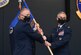 Col. Tyler R. Schaff (left), 316th Wing and Joint Base Andrews commander, passes the guidon to Col. Jason J. Lennen as he assumes command of the 316th Medical Group, during a change of command ceremony at Joint Base Andrews, Md., July 16, 2020.