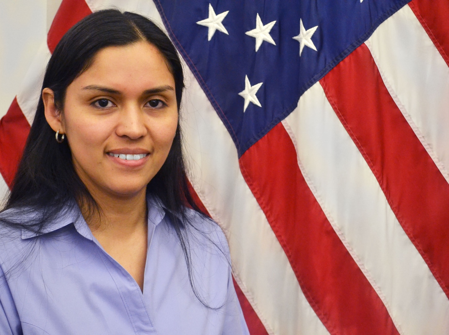 Inventory Management Specialist Ligia Perkins received a virtual coin from DLA Troop Support Commander Army Brig. Gen. Gavin Lawrence during a virtual performance review June 30, 2020 for her essential role establishing new national stock numbers for personal protective equipment in response to COVID-19.