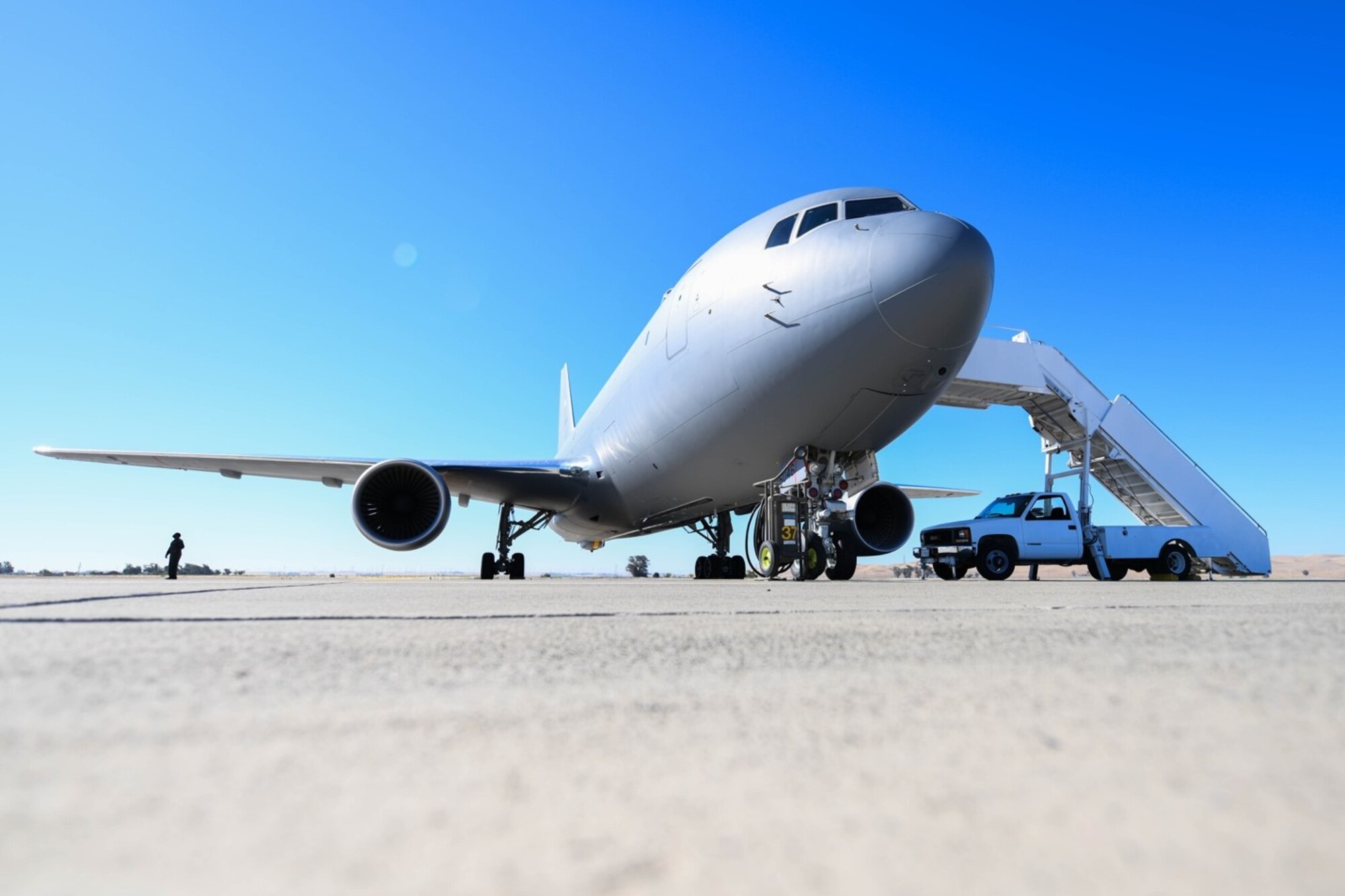 A KC-46A Pegasus assigned to McConnell Air Force Base, Kansas sits on the flightline July 11, 2020 at Travis Air Force Base, California. After six flights and 17 hours of total flying time, the successful aeromedical evacuation mission marked a key milestone in the progress of the KC-46 Initial Operational Test and Evaluation. (U.S. Air Force photo by Airman 1st Class Nilsa Garcia)