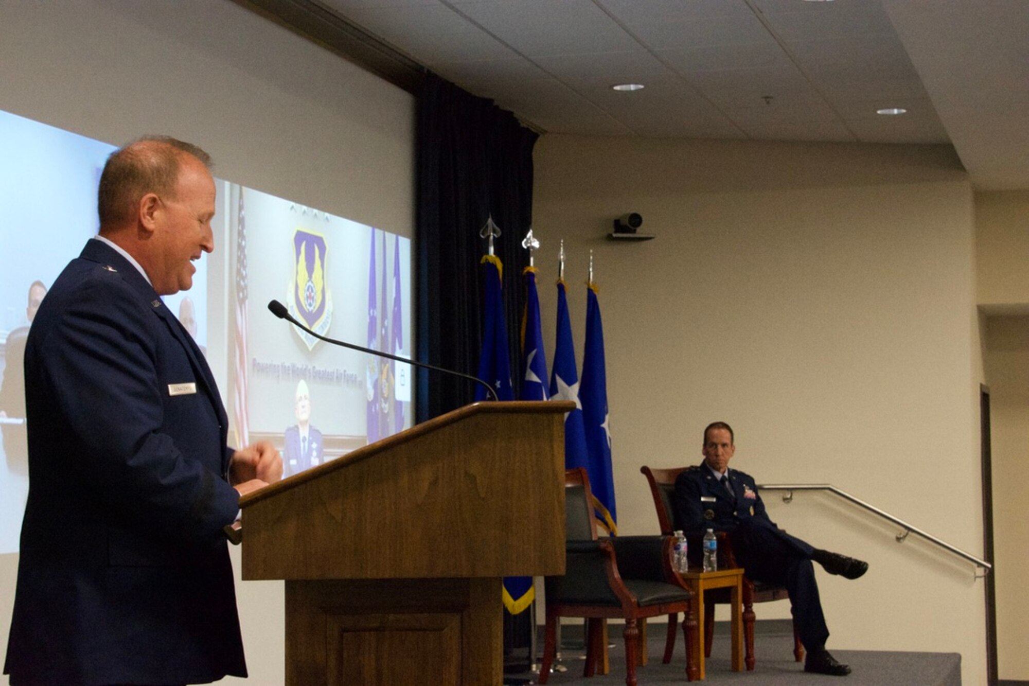 Brig. Gen. Anthony W. “Awgie” Genatempo, left, speaks to Maj. Gen. Shaun Q. Morris, right, during the Air Force Nuclear Weapons Center's ceremony where Genatempo assumed command from Morris. (Air Force photo by Capt. Matthew Rice)