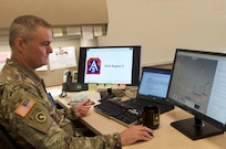 Maj. David Finn, a plans officer at the 377th Theater Sustainment Command, reviews forecast data at the command headquarters in Belle Chasse, La.