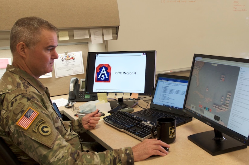 Maj. David Finn, a plans officer at the 377th Theater Sustainment Command, reviews forecast data at the command headquarters in Belle Chasse, La.