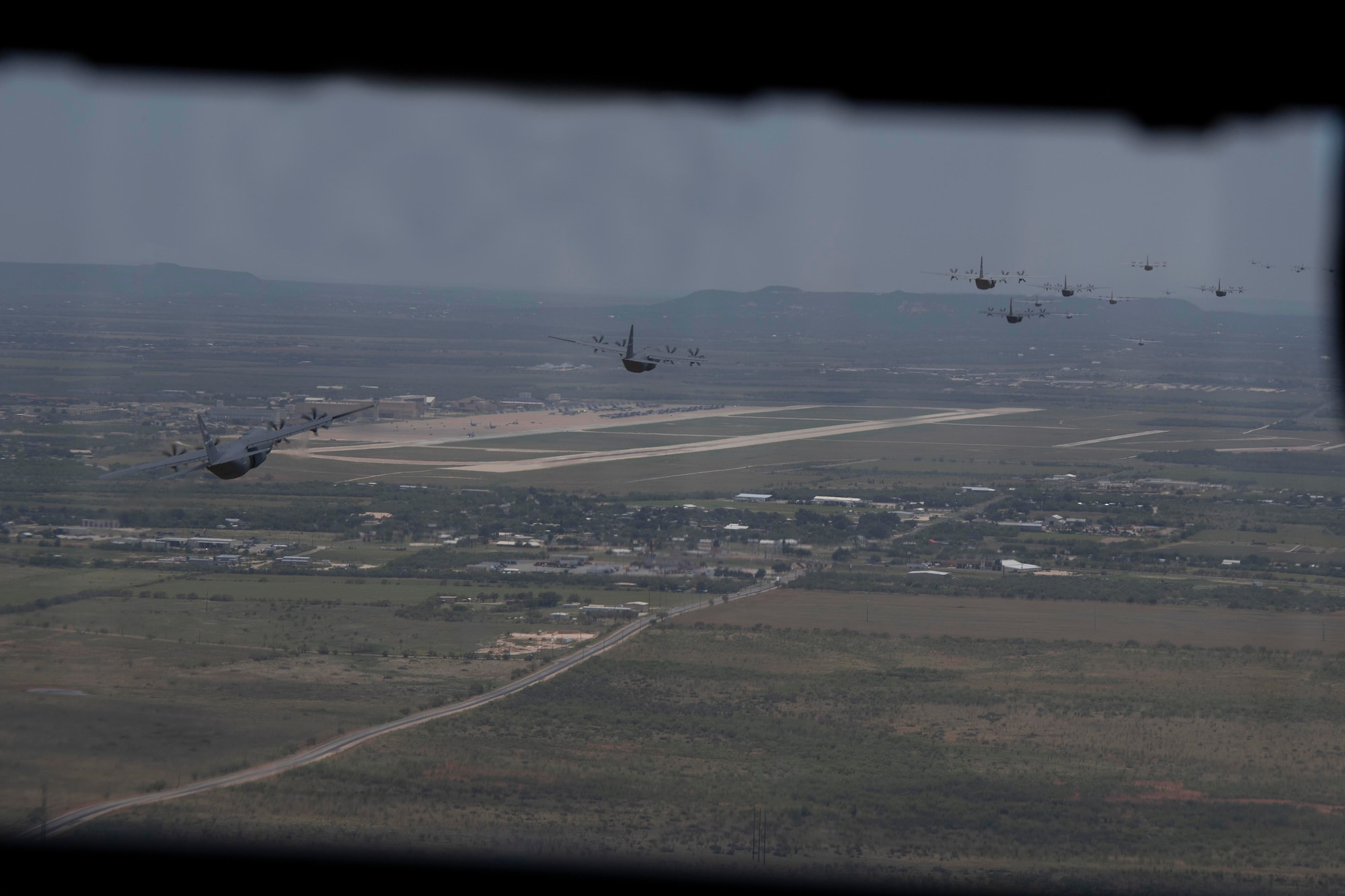 The C-130 community rewrote history July 14, successfully piloting the largest formation flight ever of C-130J Super Hercules aircraft in support of a Joint Forcible Entry exercise over Dyess Air Force Base and Big Bend, Texas.

In total, the “Herk Nation Stampede” featured a formation flight of 24 aircraft from the 317th Airlift Wing based at Dyess AFB and nine aircraft from the 19th Airlift Wing based at Little Rock AFB, Arkansas, besting the previous mark of 20 J-models set in 2013.