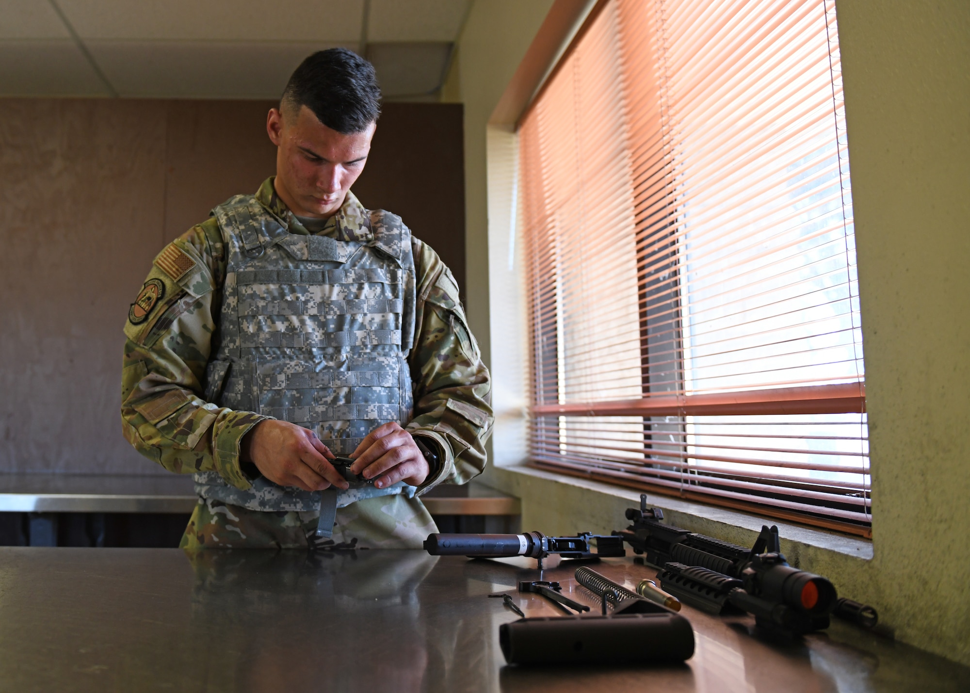 Airman 1st Class Nicholas Chapin, 9th Civil Engineering Squadron firefighter, disassembles an M4 Carbine for cleaning during a Combat Arms Training and Maintenance (CATM) course, June 22, 2020, at Beale Air Force Base California. The CATM course educates Airmen on how to properly operate and maintain weapons for forward deployed operations and for those who carry weapons everyday as part of their duties on the installation. (U.S. Air Force photo by Airman 1st Class Luis A. Ruiz-Vazquez)
